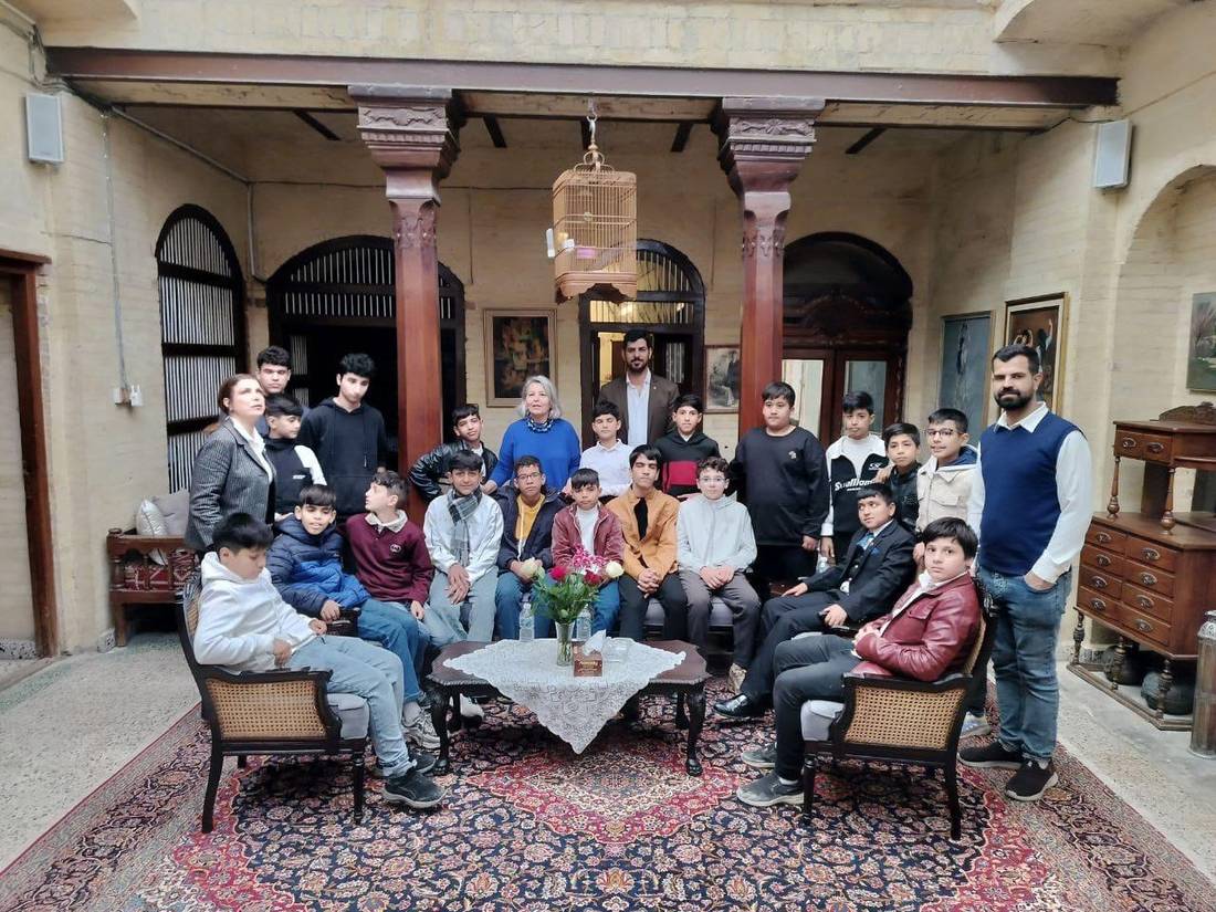 Children and hosts in the courtyard of Al-Wattar Historic House